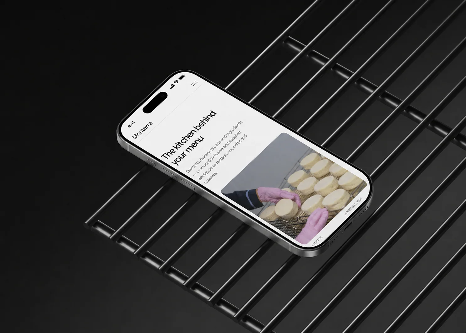 Monterra Foods digital experience shown on a phone resting on commercial kitchen racks.